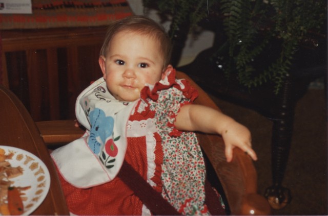 Here I am wearing the dress my Mom made me and eating my first large helping of Christams dinner. I am being served and I'm loving it, but we are incredibly vulnerable and dependent at this age and have almost no power! 